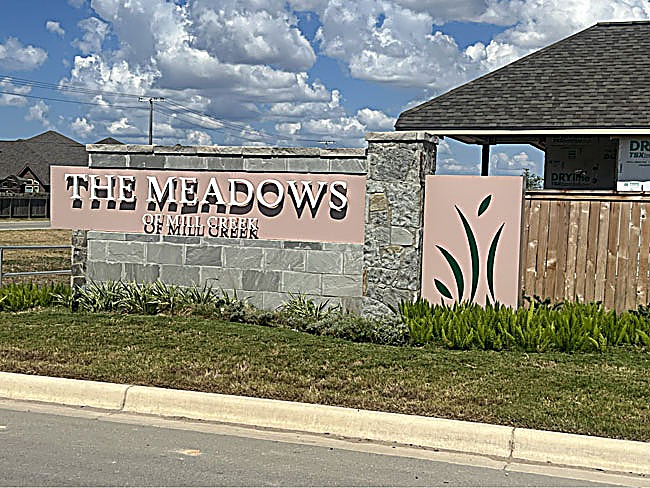 The Meadows of Mill Creek — original entry monument