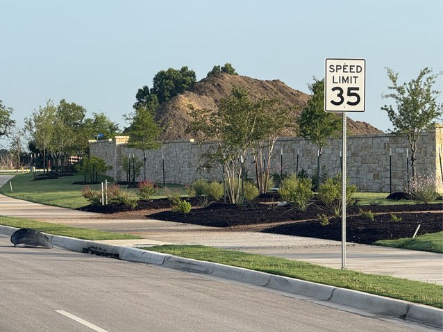 Streetside plantings with 35 mph speed limit sign